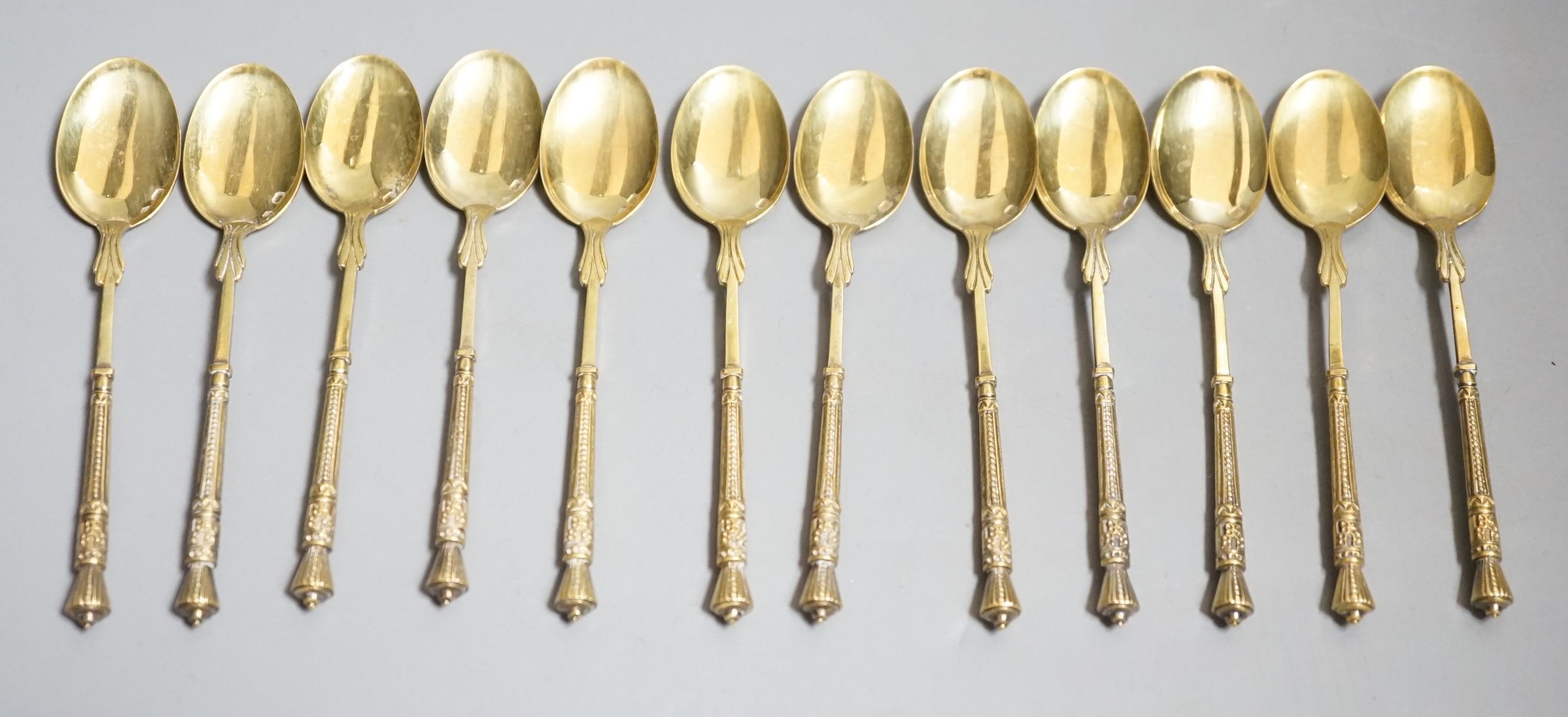A set of twelve French 950 standard gilt white metal coffee spoons, 11cm, 5.2oz.